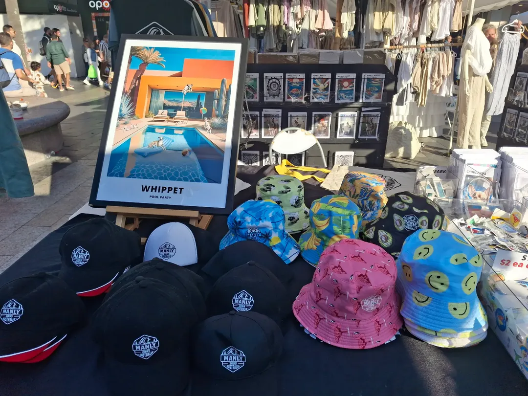Zac Nowytarger's Manly 2095 market stall selling hats, caps and prints at Manly beachfront markets Sydney